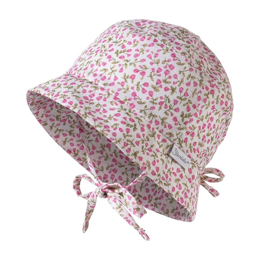 Cappello estivo per bambina in cotone con fantasia floreale rosa e regolazione posteriore.