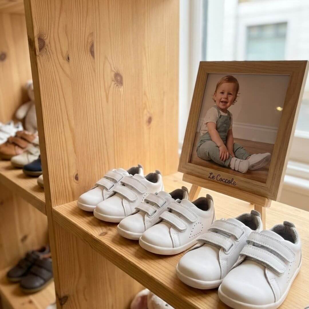 Esposizione scarpe morbide e giochi in legno Le Coccole